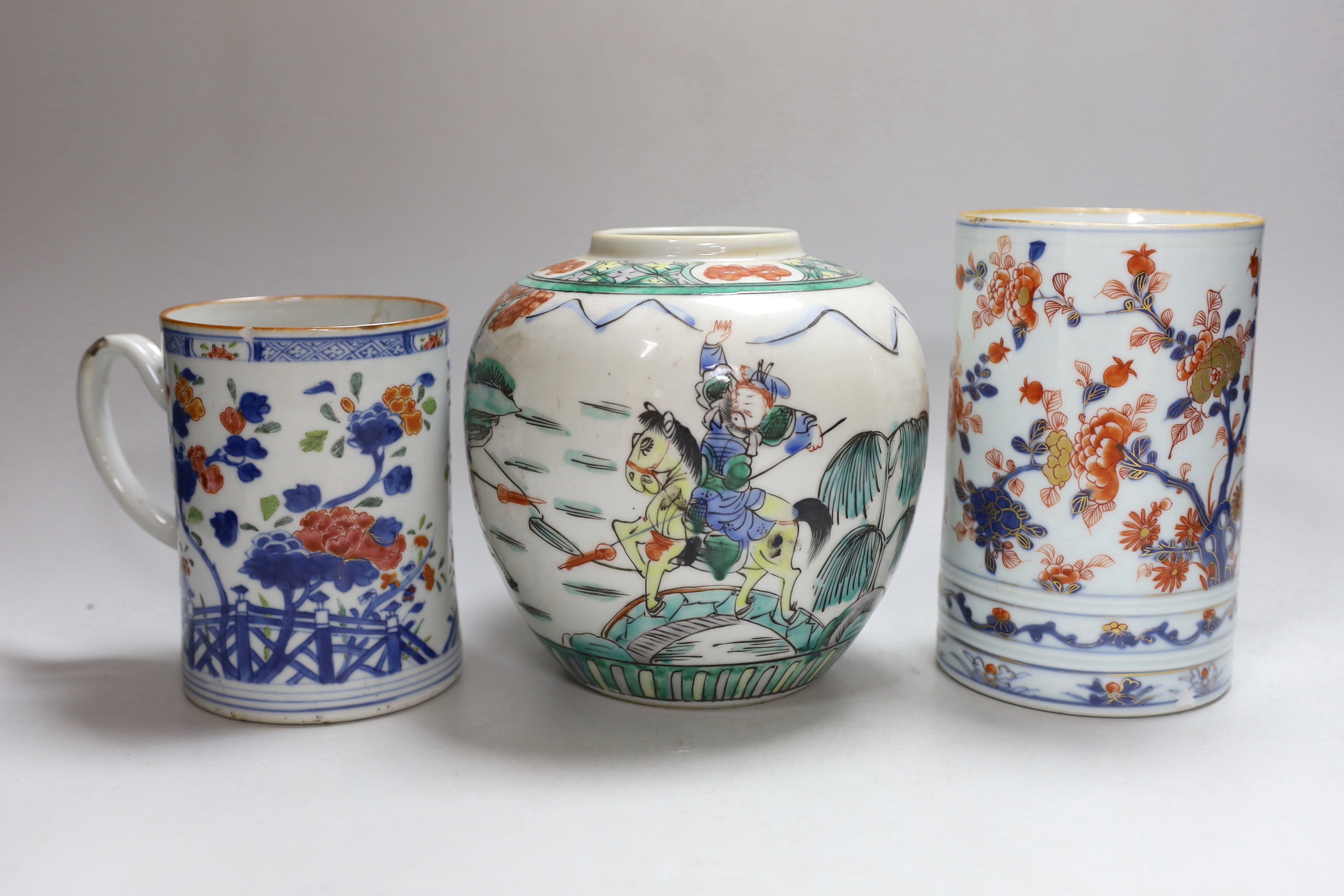 A Chinese Imari large mug, early 18th century, a Chinese famille rose mug, Qianlong period and a famille verte jar, tallest 17cm high